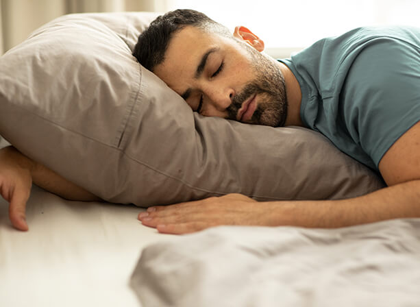 Man sleeping peacefully in bed